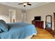 Spacious primary bedroom with ensuite bath, walk-in closet and television at 2507 Silver Oaks Dr, Carmel, IN 46032