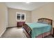 This bedroom features soft carpet, light-filled rooms, and a classic wood bed at 2507 Silver Oaks Dr, Carmel, IN 46032