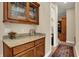 Wooden buffet featuring granite countertops and glass faced cabinets at 2507 Silver Oaks Dr, Carmel, IN 46032