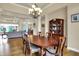 Spacious dining room with hardwood floors and an adjacent living room in the distance at 2507 Silver Oaks Dr, Carmel, IN 46032