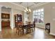 Charming dining room featuring hardwood floors and a large window overlooking the backyard at 2507 Silver Oaks Dr, Carmel, IN 46032