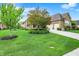 Spacious home with a well-manicured lawn, mature trees, and a convenient three-car garage at 2507 Silver Oaks Dr, Carmel, IN 46032
