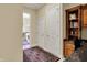 Hallway with wooden desk and cabinets to the right and doorway to the laundry room to the left at 2507 Silver Oaks Dr, Carmel, IN 46032