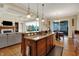 Open concept kitchen features a central island with seating and sink at 2507 Silver Oaks Dr, Carmel, IN 46032
