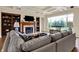 Cozy living room with a fireplace, and built-in bookshelves, with light filled window views at 2507 Silver Oaks Dr, Carmel, IN 46032