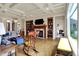 Comfortable living room featuring a fireplace, built-in shelving and large window at 2507 Silver Oaks Dr, Carmel, IN 46032
