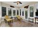 Bright sunroom featuring tile floor, multiple windows and views of the backyard at 2507 Silver Oaks Dr, Carmel, IN 46032