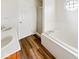 This bathroom features wood-look floors, a double sink vanity, tub and shower at 2623 Kirk Ct, Lebanon, IN 46052