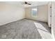 Bedroom with neutral walls, carpeted floors, a ceiling fan, and a window view of the neighborhood at 2623 Kirk Ct, Lebanon, IN 46052