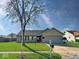 Charming single-story home with a well-maintained lawn and attached two-car garage at 2623 Kirk Ct, Lebanon, IN 46052