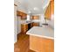 Efficient kitchen featuring light countertops, wood cabinets, and hardwood floors at 2623 Kirk Ct, Lebanon, IN 46052