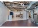A partially finished basement space suitable for various uses with a freezer and utilities at 2735 S Taft Ave, Indianapolis, IN 46241