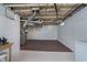 Spacious unfinished basement with painted walls and floor and visible ductwork and utilities at 2735 S Taft Ave, Indianapolis, IN 46241