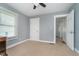 A cozy bedroom features soft carpet, two windows, and convenient access to the home's other rooms at 2735 S Taft Ave, Indianapolis, IN 46241