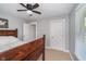 A bright bedroom featuring a rustic bed frame and neutral-toned walls with two doorways at 2735 S Taft Ave, Indianapolis, IN 46241