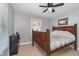 A sunlit bedroom with a wooden bed frame and a window offering a view of the outdoors at 2735 S Taft Ave, Indianapolis, IN 46241
