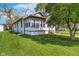 Inviting home exterior surrounded by green lawn, providing a serene and peaceful living environment at 2735 S Taft Ave, Indianapolis, IN 46241