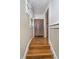Hallway features hardwood floors and access to storage, leading to other areas of the home at 2735 S Taft Ave, Indianapolis, IN 46241