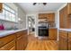 A bright kitchen featuring wood flooring, stainless steel appliances, and natural light from the window at 2735 S Taft Ave, Indianapolis, IN 46241