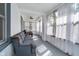 Bright sunroom featuring comfortable seating and large windows, perfect for relaxing and enjoying the view at 2735 S Taft Ave, Indianapolis, IN 46241