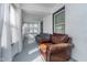 Cozy sunroom featuring comfortable seating with couch and armchair, creating a relaxing retreat at 2735 S Taft Ave, Indianapolis, IN 46241