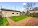 Backyard featuring a brick patio, a small wooden staircase and a detached garage at 2926 Indianapolis Ave, Indianapolis, IN 46208