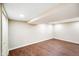 Unfinished basement space with wood-look flooring, neutral paint, and recessed lighting at 2926 Indianapolis Ave, Indianapolis, IN 46208