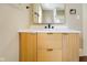 Stylish bathroom vanity with a modern sink, chic hardware, and ample storage at 2926 Indianapolis Ave, Indianapolis, IN 46208