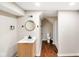Bathroom features a vanity with a sink, a round mirror, and a toilet and shower in the background at 2926 Indianapolis Ave, Indianapolis, IN 46208