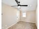 Comfortable bedroom with a modern ceiling fan, neutral walls, and a window at 2926 Indianapolis Ave, Indianapolis, IN 46208