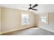 Inviting bedroom with carpet, ceiling fan, neutral walls, and natural light from windows at 2926 Indianapolis Ave, Indianapolis, IN 46208