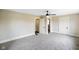 Spacious bedroom with neutral walls, carpet, and multiple doors at 2926 Indianapolis Ave, Indianapolis, IN 46208