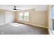 Bright bedroom with neutral walls, carpet, ceiling fan, and windows at 2926 Indianapolis Ave, Indianapolis, IN 46208