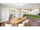 Bright and open dining area features modern kitchen and lots of natural light at 2926 Indianapolis Ave, Indianapolis, IN 46208