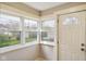 Welcoming entryway bathed in natural light from three windows and a half-lite door at 2926 Indianapolis Ave, Indianapolis, IN 46208