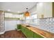 Modern kitchen features stylish light fixture, butcher block counters and a subway tile backsplash at 2926 Indianapolis Ave, Indianapolis, IN 46208