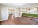 Open concept dining and kitchen space features modern cabinetry and brick accent wall at 2926 Indianapolis Ave, Indianapolis, IN 46208