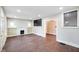 Spacious living room with white fireplace, hardwood floors, and ample natural light at 2926 Indianapolis Ave, Indianapolis, IN 46208