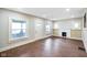 Bright and airy living room with hardwood floors and a charming fireplace at 2926 Indianapolis Ave, Indianapolis, IN 46208