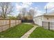 Spacious backyard features a well-maintained lawn at 310 W 43Rd St, Indianapolis, IN 46208