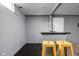 Fun basement bar area with stylish stools, neutral walls, and ample space for entertaining at 310 W 43Rd St, Indianapolis, IN 46208