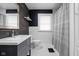 Stylish bathroom with rustic wood wall accents, modern sink, and sleek design at 310 W 43Rd St, Indianapolis, IN 46208