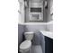 Stylish bathroom featuring updated sink vanity, framed mirror, and neutral tile at 310 W 43Rd St, Indianapolis, IN 46208