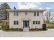 Inviting two-story home featuring vinyl siding, a charming front entrance, and a well-maintained lawn at 310 W 43Rd St, Indianapolis, IN 46208