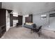 Cozy living room with plush carpet, neutral walls, and ample seating for relaxation at 310 W 43Rd St, Indianapolis, IN 46208