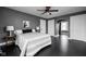 Spacious main bedroom with neutral colors, ample closet space, and ceiling fan at 310 W 43Rd St, Indianapolis, IN 46208