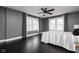 Large main bedroom featuring neutral colors, beautiful hardwood floors, and natural light at 310 W 43Rd St, Indianapolis, IN 46208