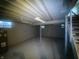 Unfinished basement with concrete floors, a water heater and ceiling support beams at 3202 Acacia Dr, Indianapolis, IN 46214