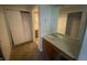 This bathroom features a vanity with a mirror and cabinets at 3202 Acacia Dr, Indianapolis, IN 46214