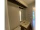 This bathroom features a vanity with a mirror and wood cabinets at 3202 Acacia Dr, Indianapolis, IN 46214